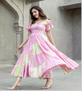Indian women wearing light pink tiered dress