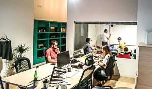 How do you collaborate with other coworkers in coworking spaces?